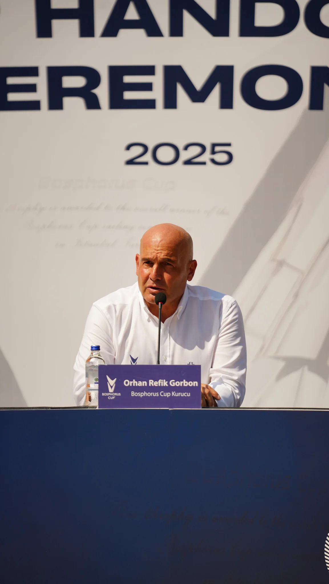 Bosphorus Cup founder Orhan Refik Gorbon speaking at an event.