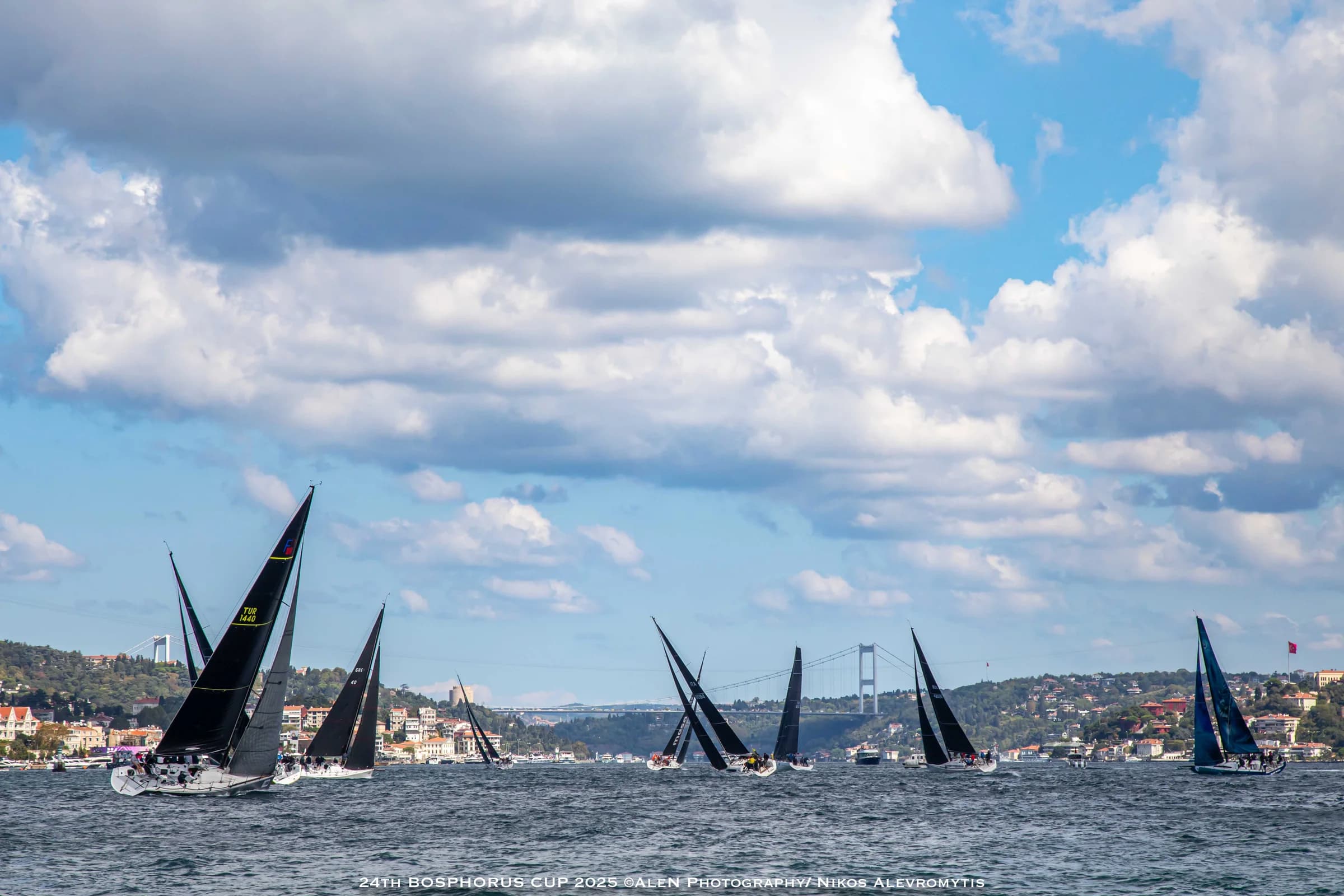 The Bosphorus Cup fleet racing through Istanbul beneath a wide sky.