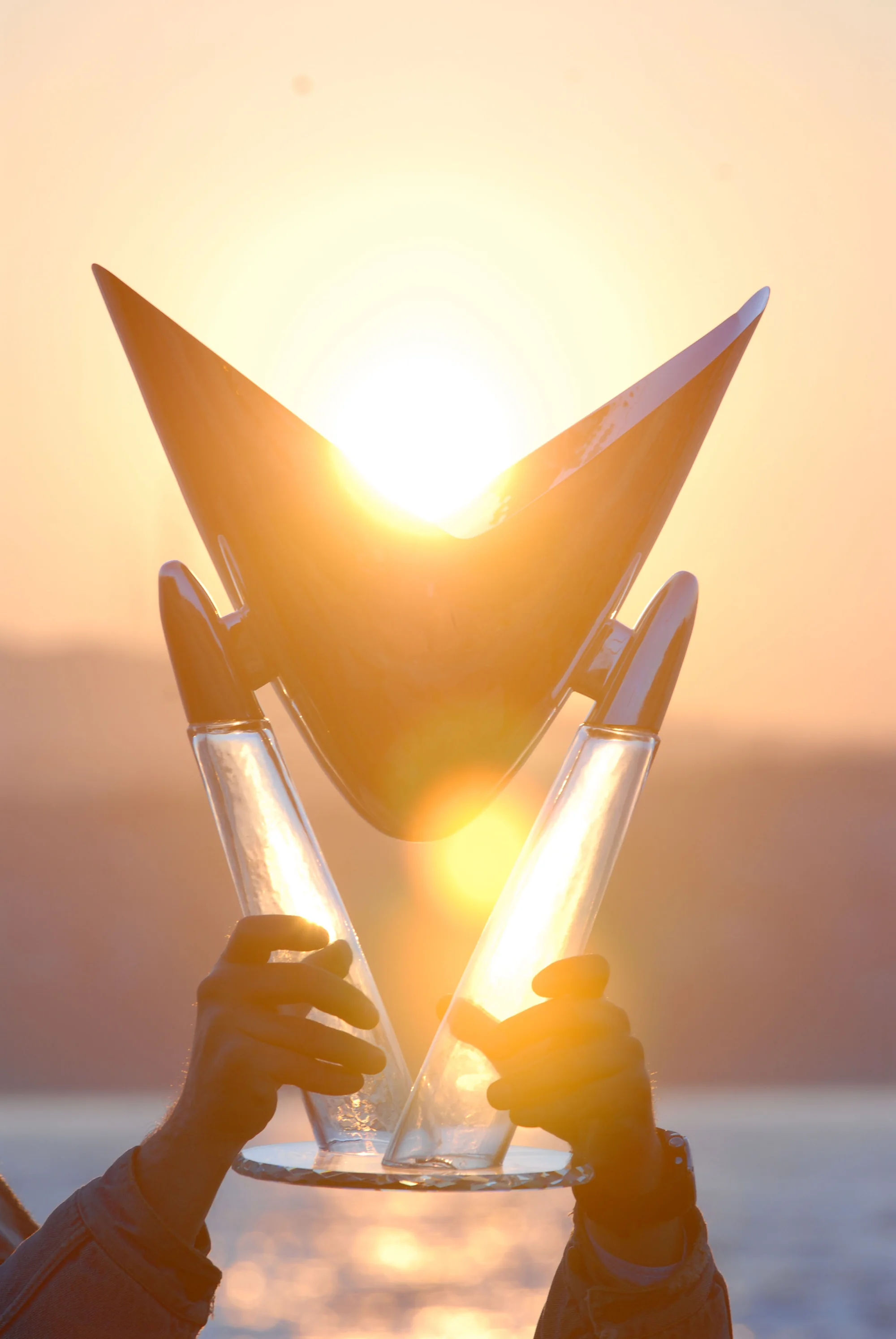 The Bosphorus Cup perpetual trophy raised into the evening light.