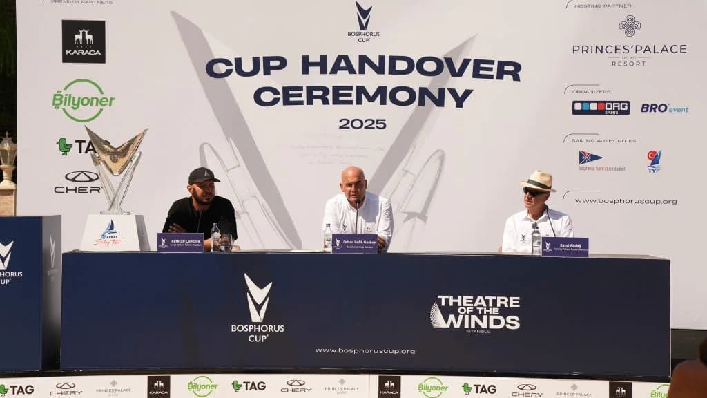 Three speakers beside the trophy at the 2025 Cup Handover Ceremony.