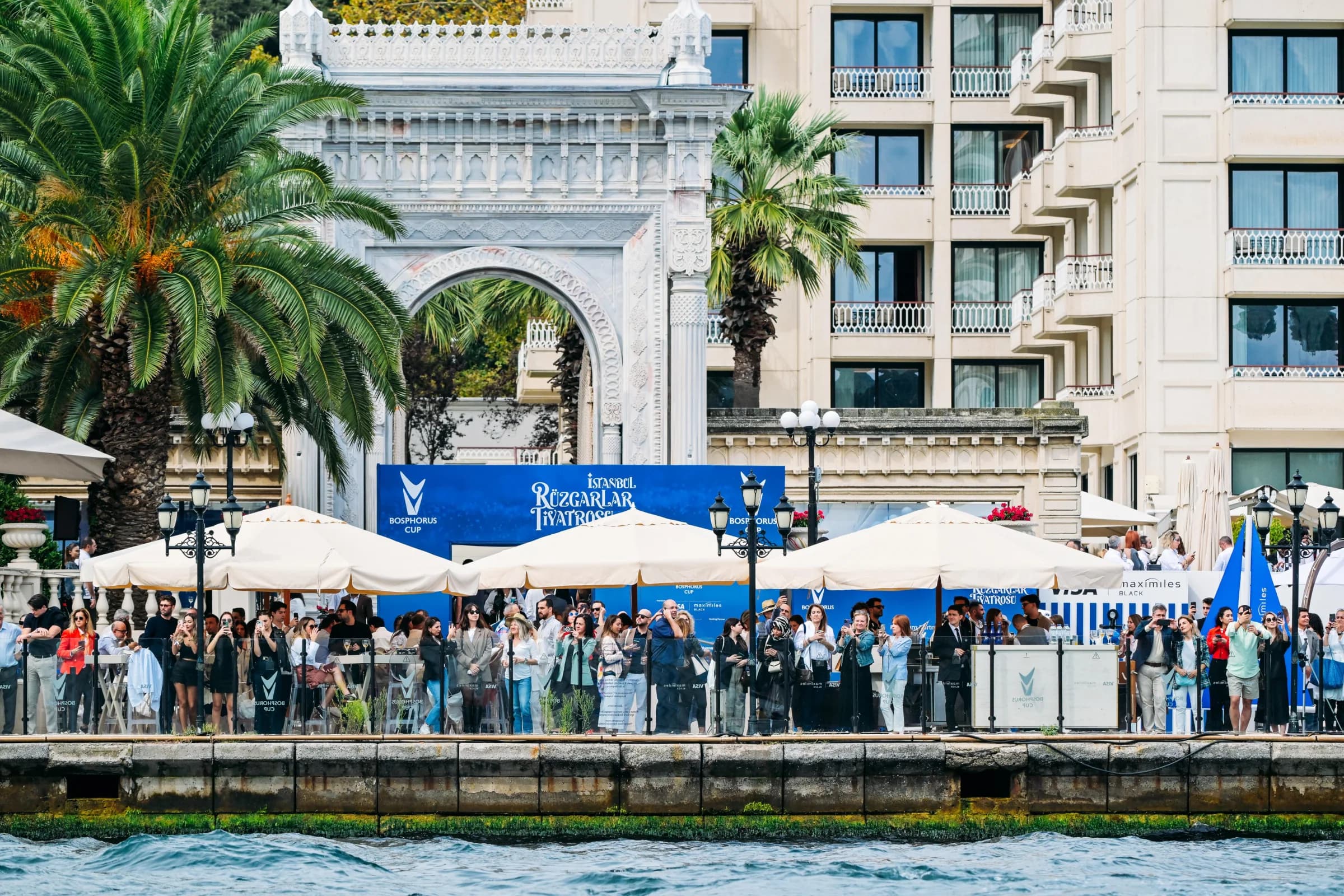 Guests gather at the Bosphorus Cup hospitality programme beside Çırağan Palace.