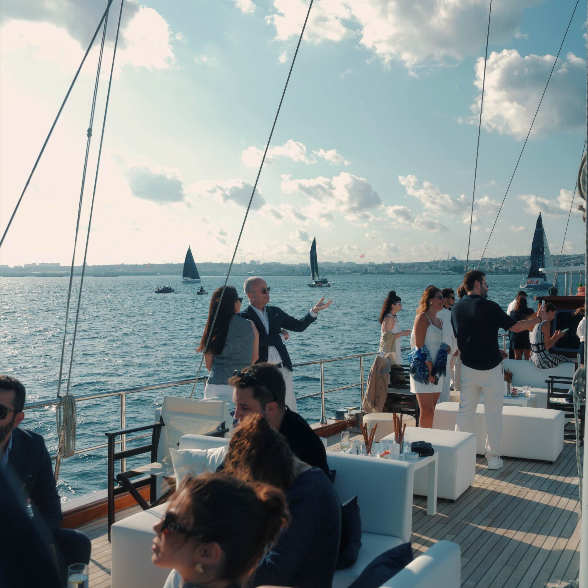 Guests watch the Bosphorus Cup from the official hospitality motor yacht.